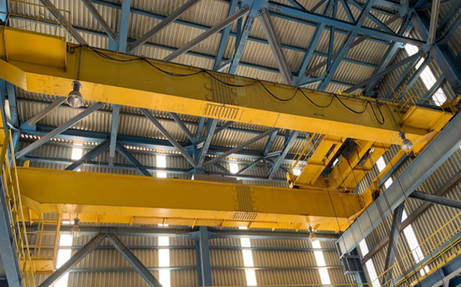 Overhead travelling cranes within a workshop